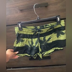 Green and black tropical shorts
